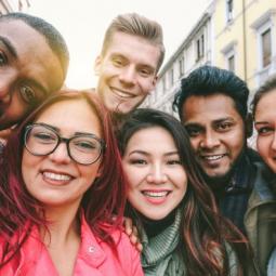 Group of young people from different countries, all smiling