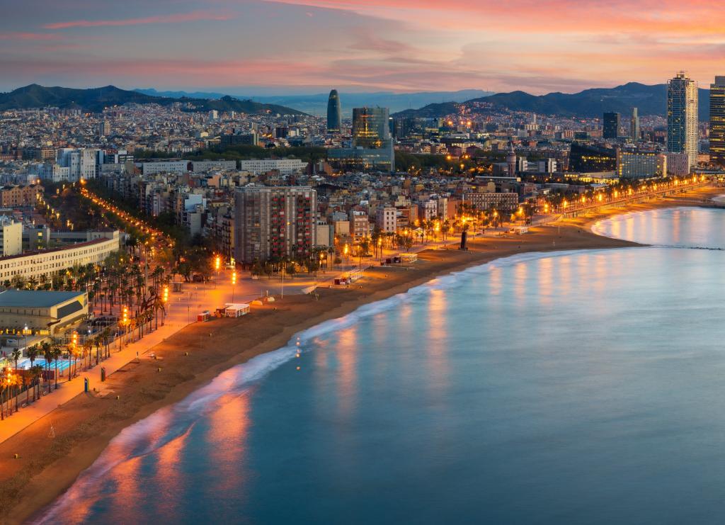 Barceloneta at night, lit up by the city’s lights
